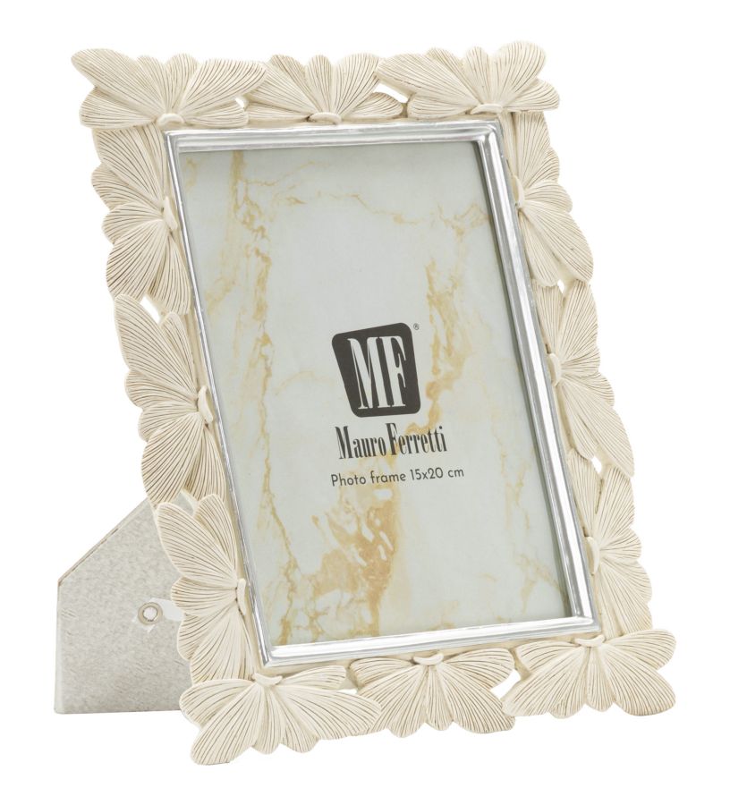 "CORNICE BUTTERFLY CM 23X27,7X2 (MISURA INTERNA CM 15X20)
"